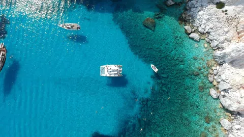 Sailing Milos in October with Snorkel Stops and Lunch Aboard